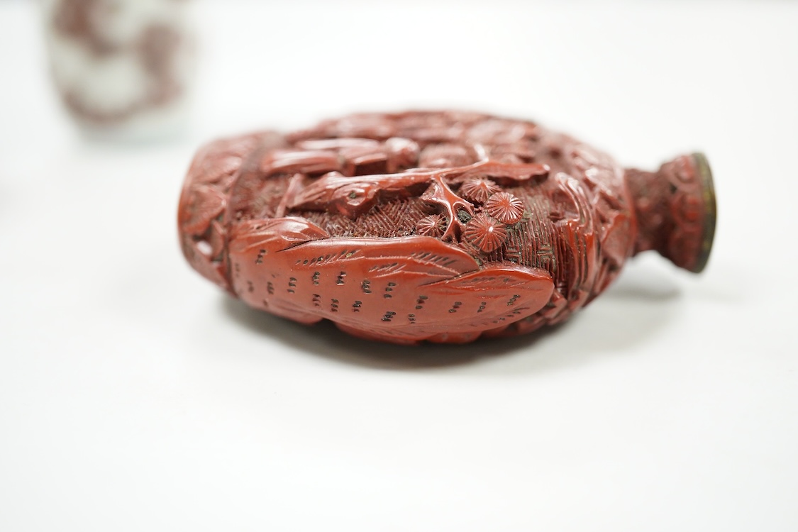 A Chinese cinnabar lacquer snuff bottle, a glass overlay snuff bottle and an underglaze copper red snuff bottle-9cm high (3)